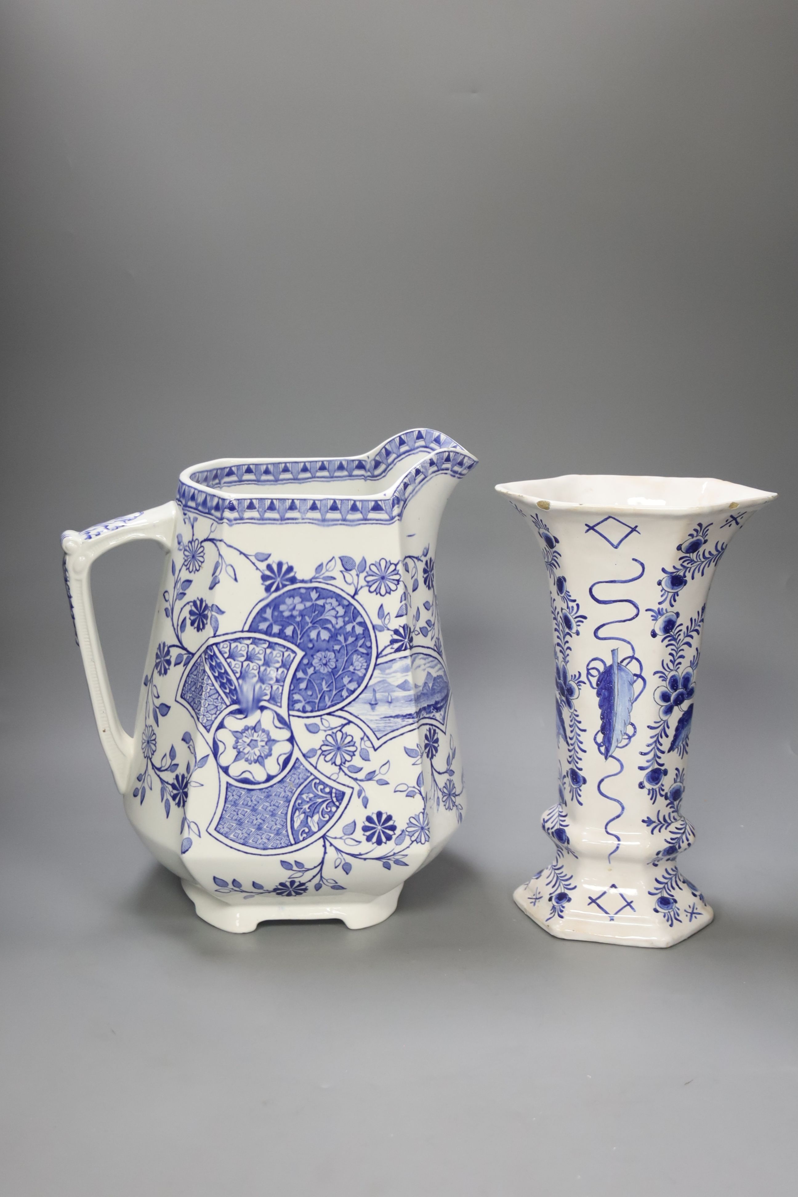 A Blenheim patterned blue and white jug and a Delft vase, tallest 29cm